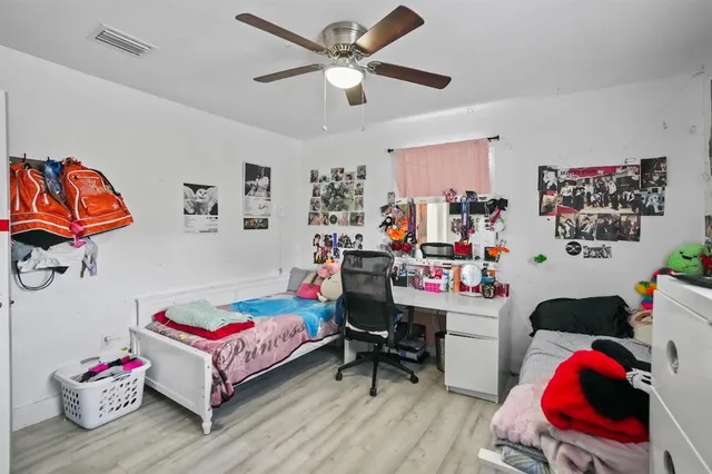 a bedroom with a bed and furniture