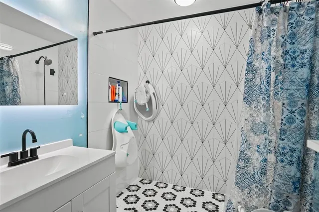 a bathroom with a sink and a mirror