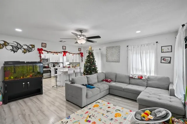 a living room with furniture and a flat screen tv