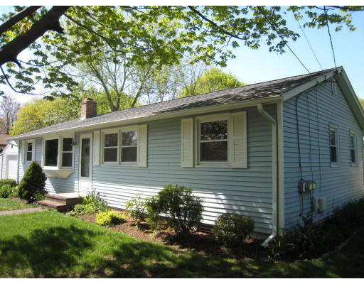 1 Virginia Road Medway, MA 02053 - Photo 1 of 10 a backyard of a house with table and chairs potted plants and large tree
