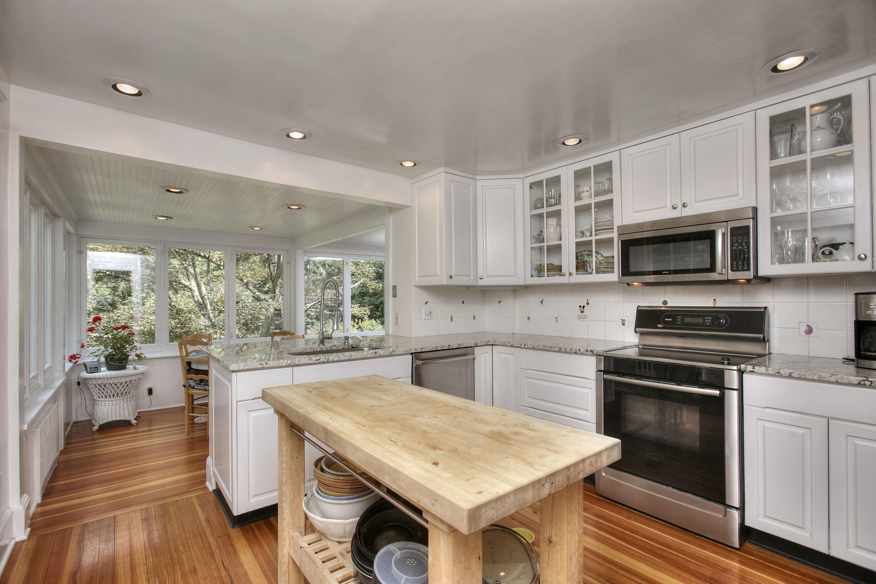 1006 Silvermine Road New Canaan, CT 06840 - Photo 11 of 39 a kitchen with a stove a sink and a microwave