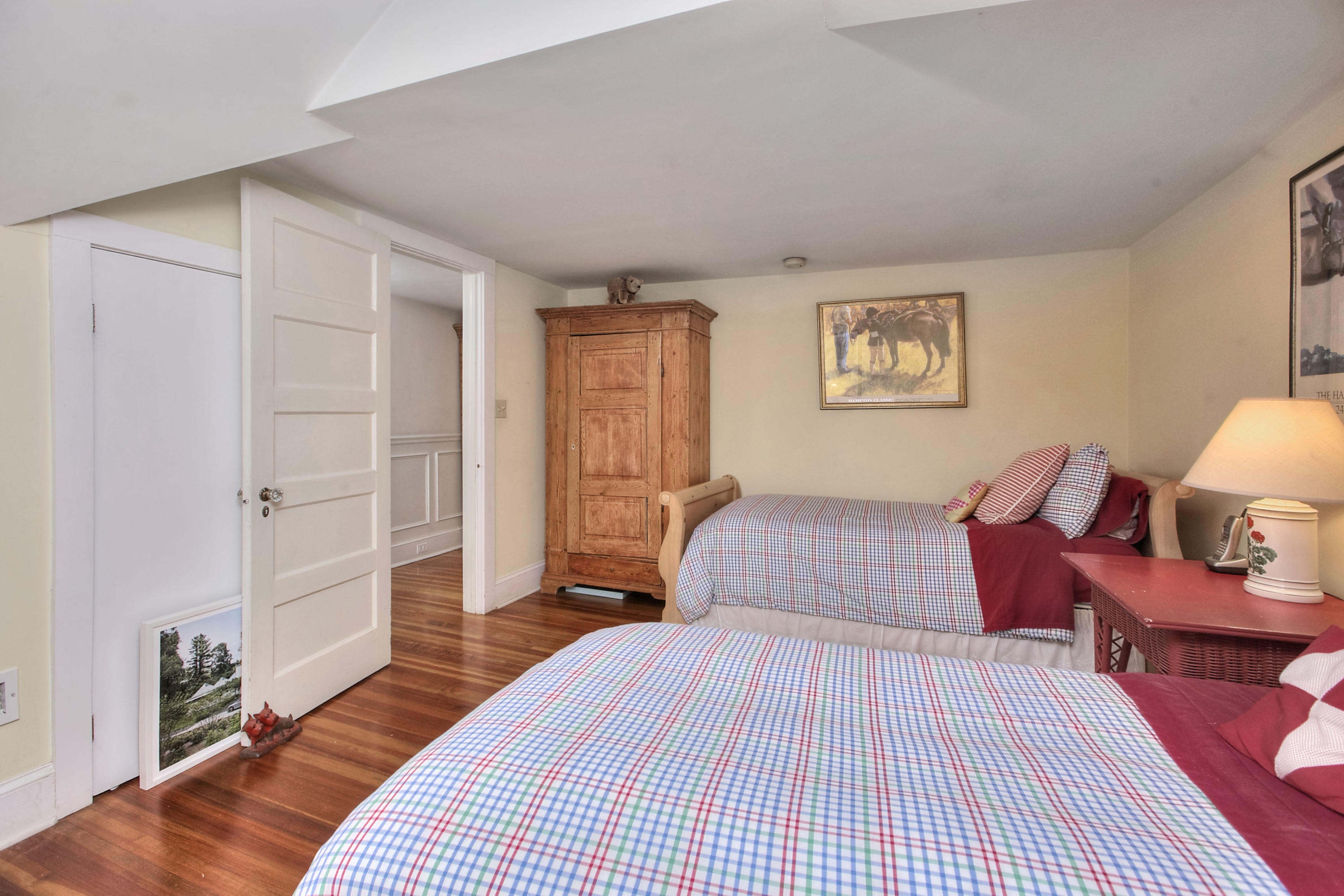 1006 Silvermine Road New Canaan, CT 06840 - Photo 22 of 39 a bedroom with a bed and wooden floor