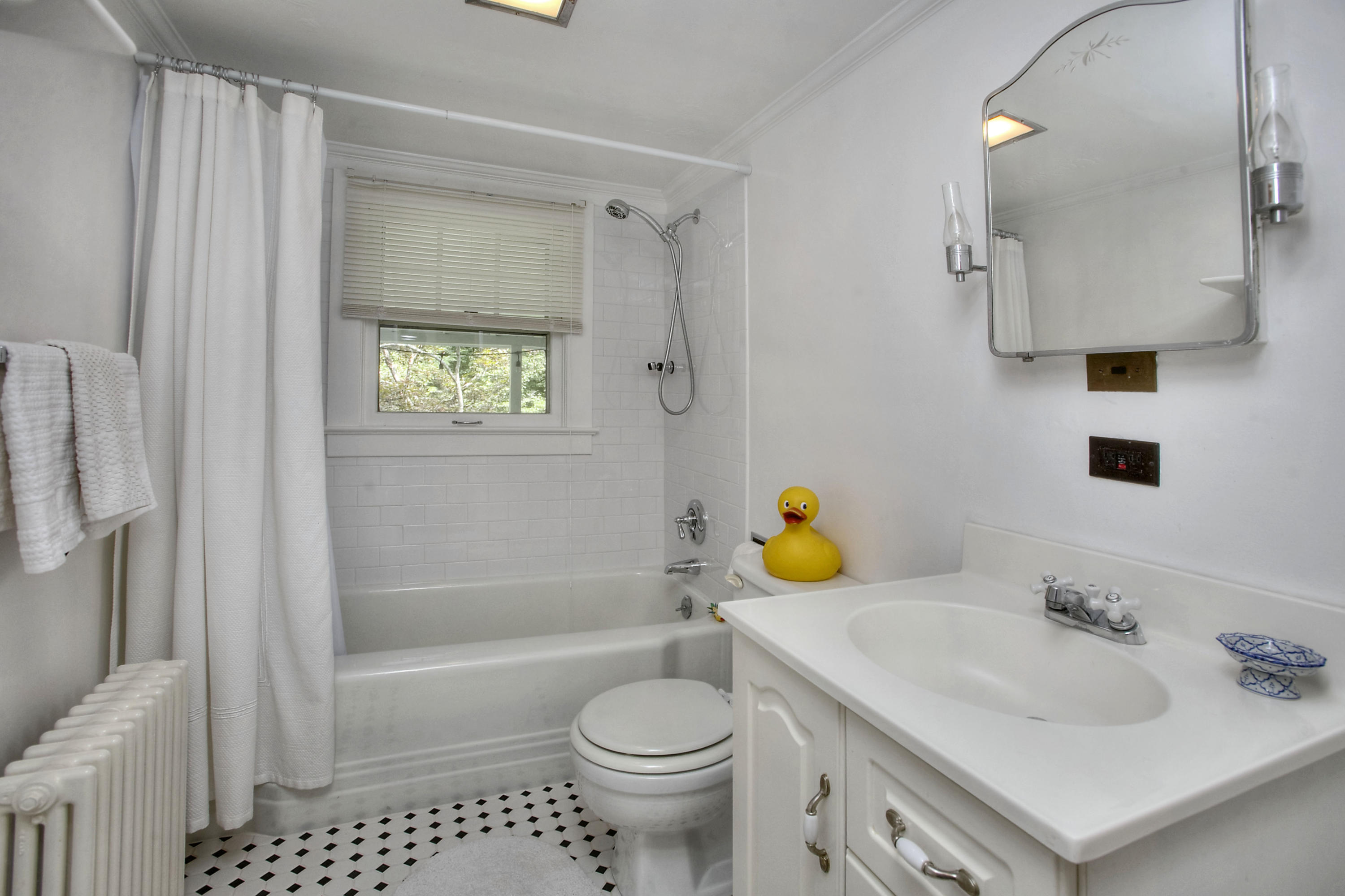 1006 Silvermine Road New Canaan, CT 06840 - Photo 23 of 39 a bathroom with a sink toilet and shower