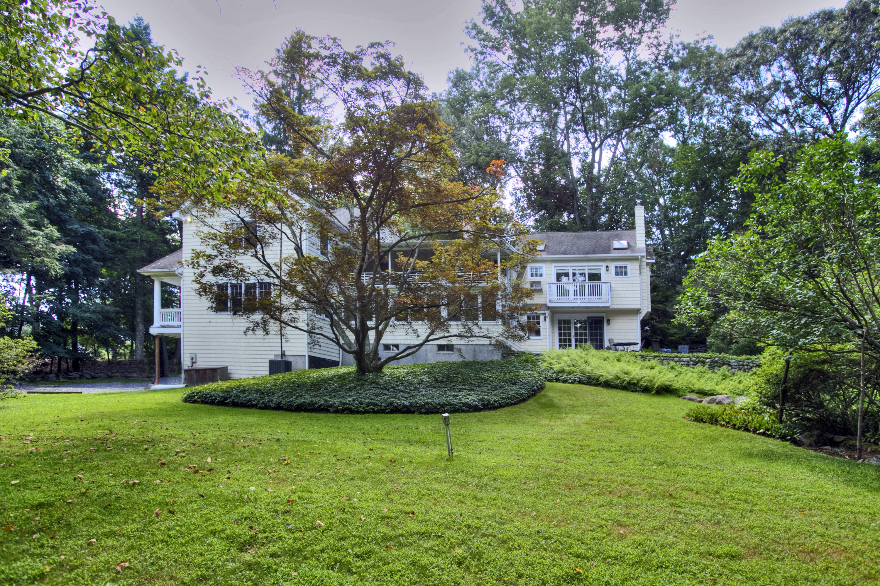 1006 Silvermine Road New Canaan, CT 06840 - Photo 32 of 39 a view of a house with a yard
