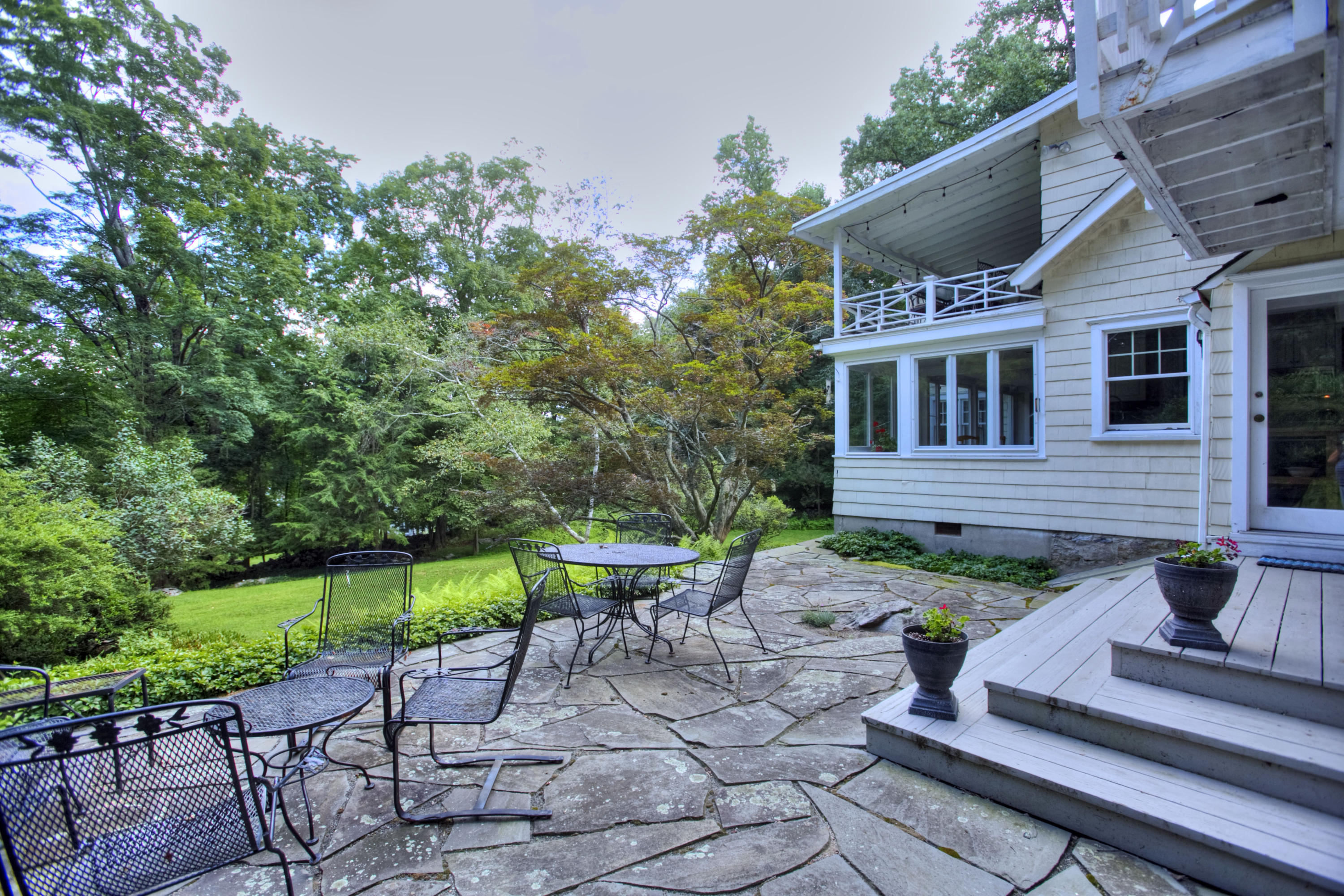 1006 Silvermine Road New Canaan, CT 06840 - Photo 35 of 39 a view of house with backyard outdoor seating and green space