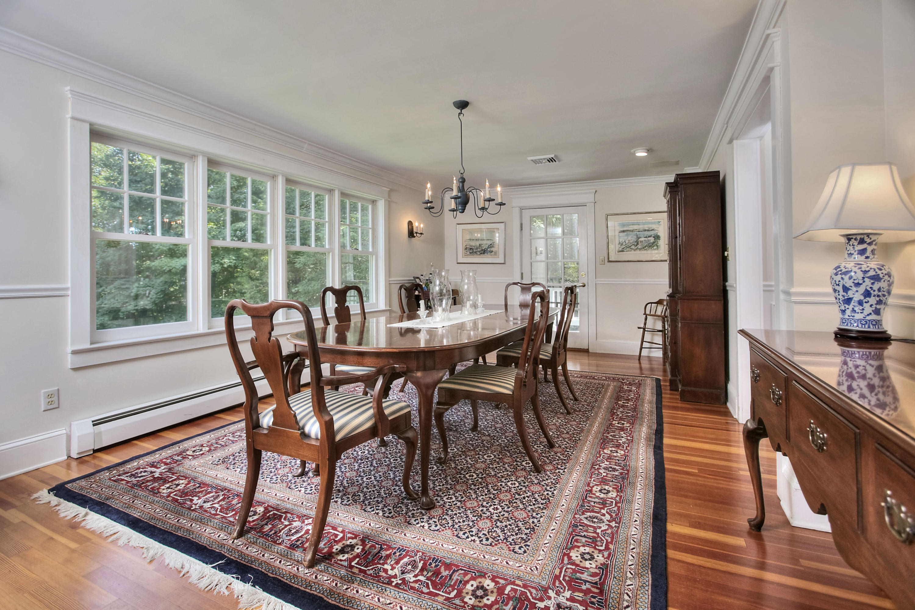 1006 Silvermine Road New Canaan, CT 06840 - Photo 7 of 39 a view of a dining room with furniture window and outside view