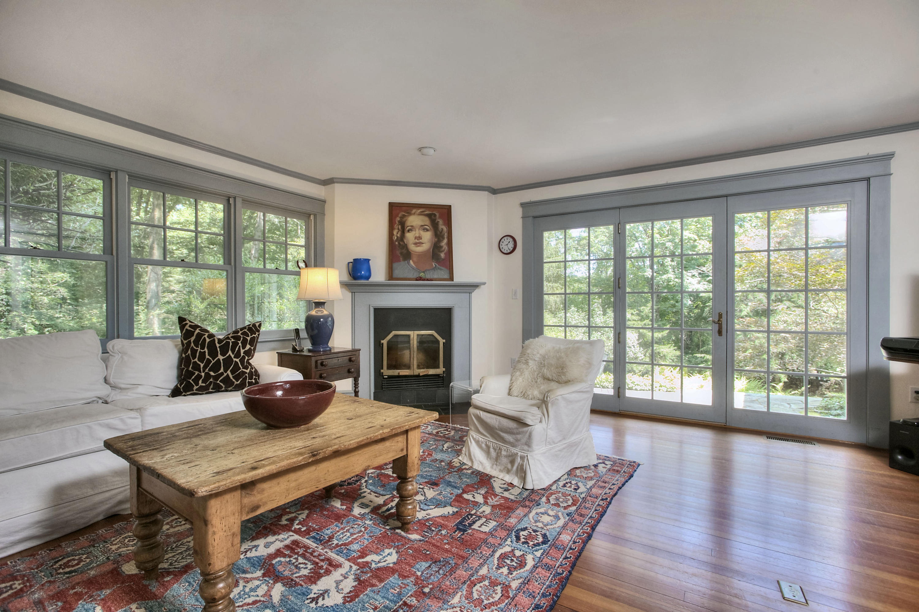 1006 Silvermine Road New Canaan, CT 06840 - Photo 10 of 39 a living room with furniture a table and a large window