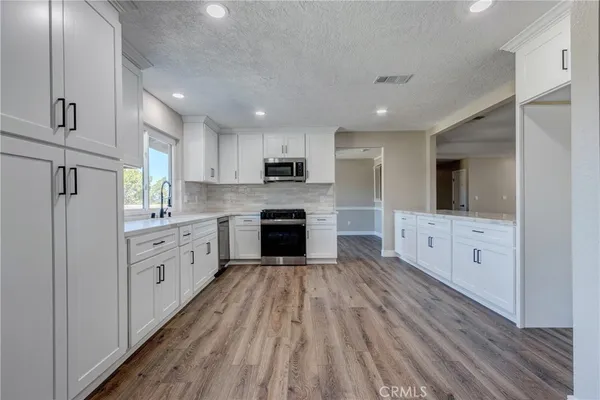 a large bathroom with a sink and a large mirror