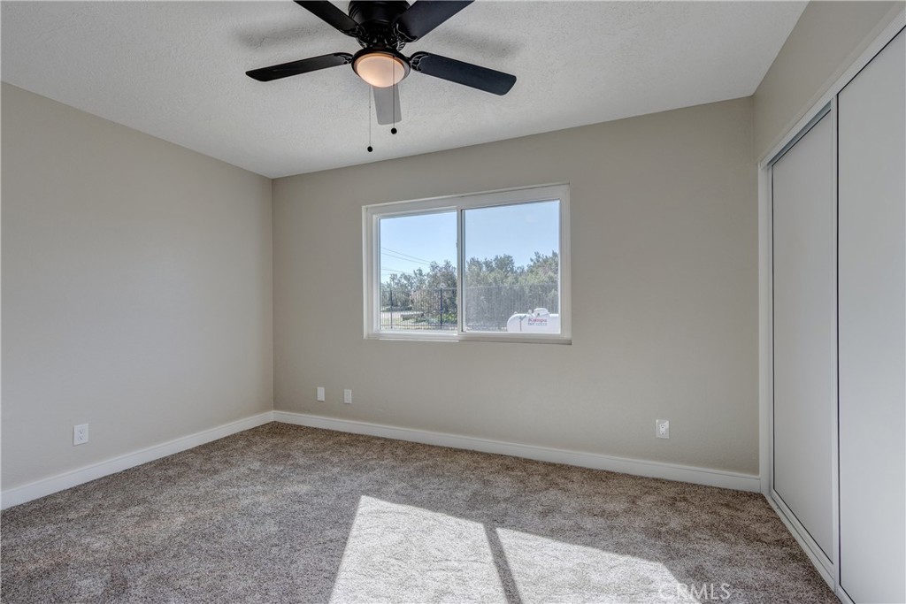 6572 Merced Road Oak Hills, CA 92344 - Photo 43 of 62 a view of an empty room with a window