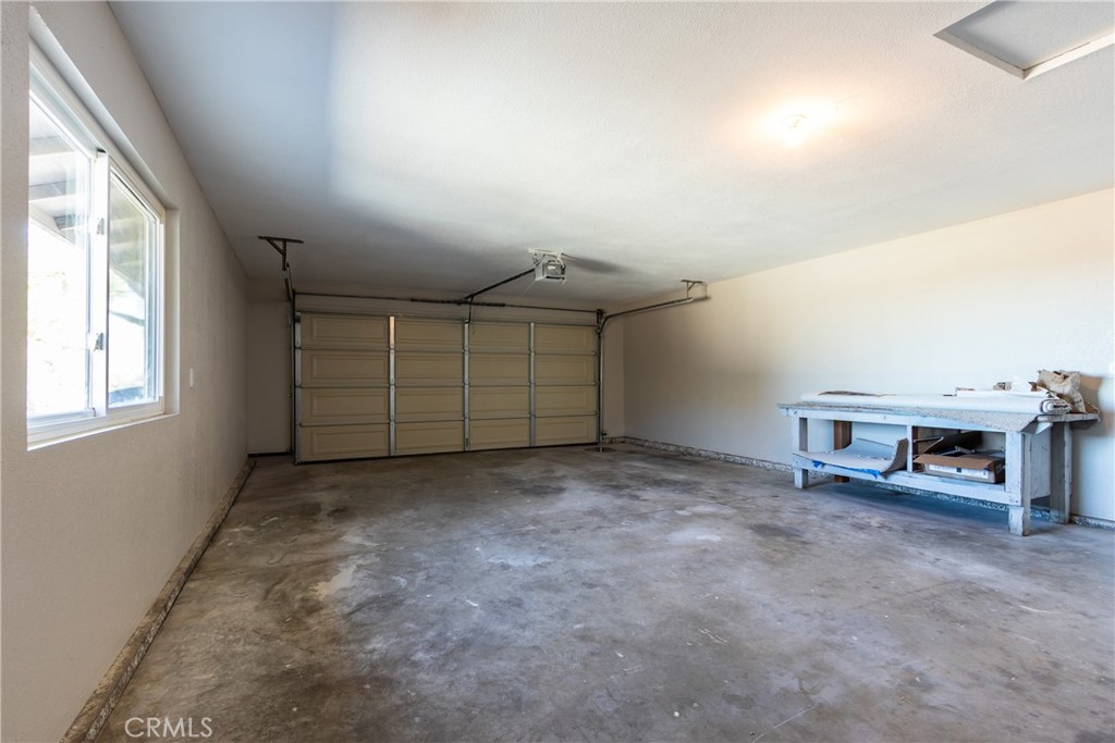 6572 Merced Road Oak Hills, CA 92344 - Photo 46 of 62 an empty room with furniture and window