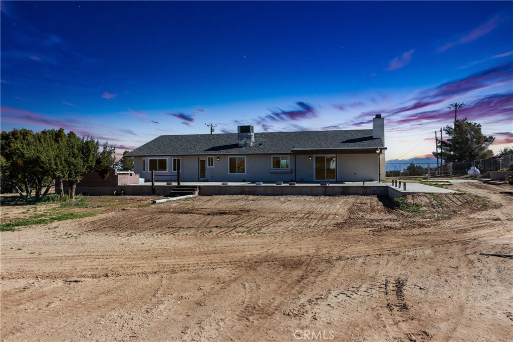 6572 Merced Road Oak Hills, CA 92344 - Photo 48 of 62 a front view of a house with a yard