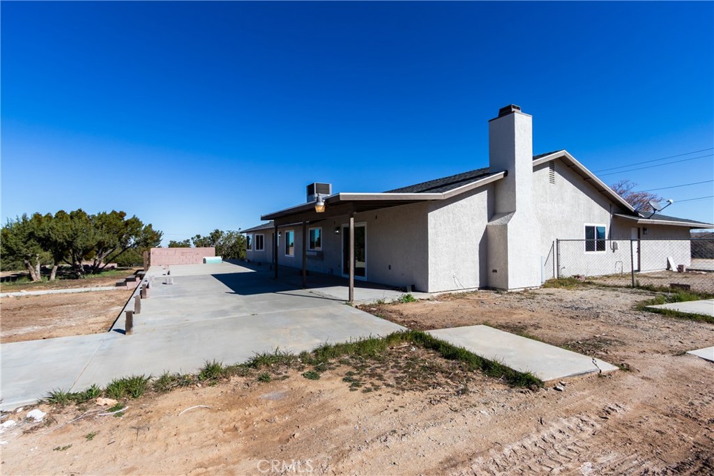 6572 Merced Road Oak Hills, CA 92344 - Photo 50 of 62 a view of a house with backyard