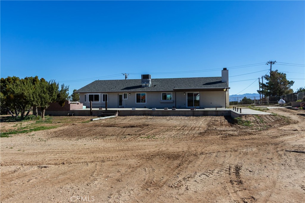 6572 Merced Road Oak Hills, CA 92344 - Photo 52 of 62 a front view of a house with a yard