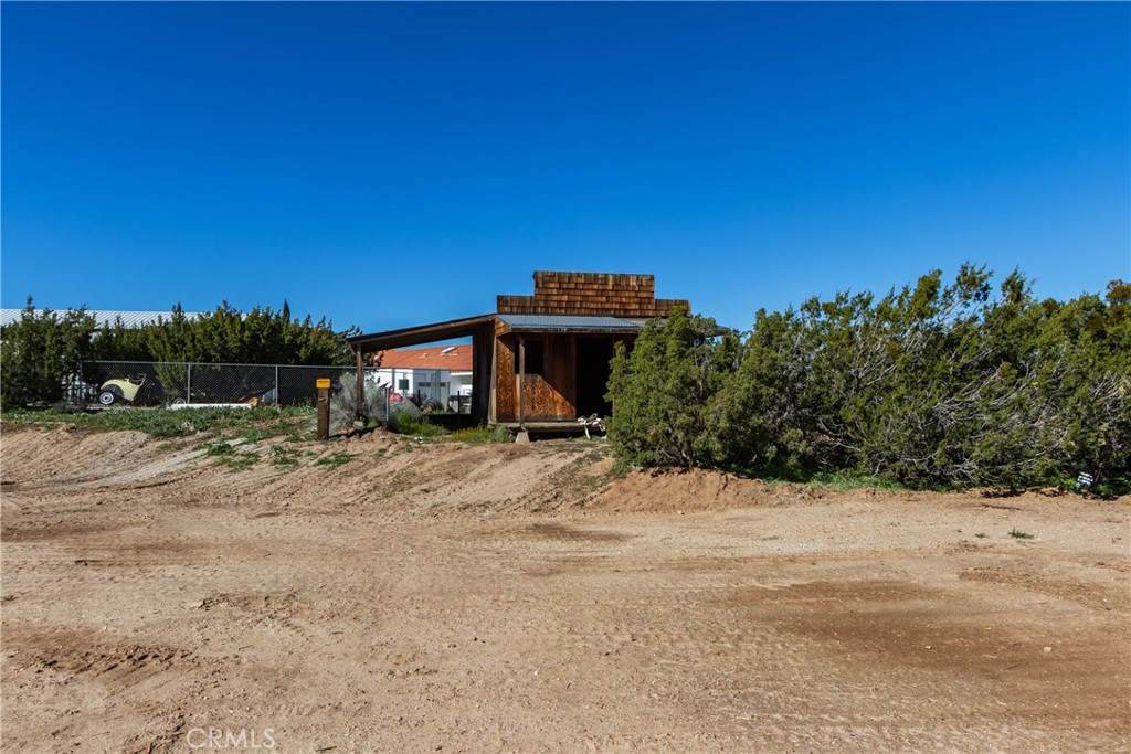 6572 Merced Road Oak Hills, CA 92344 - Photo 58 of 62 a view of a house with a yard