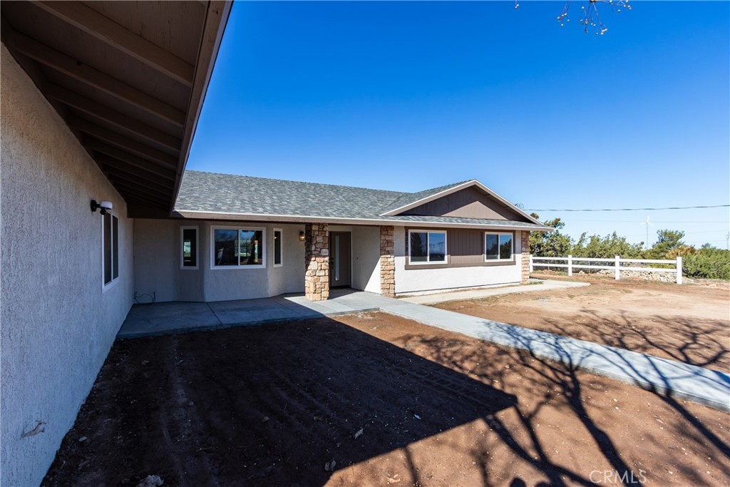 6572 Merced Road Oak Hills, CA 92344 - Photo 6 of 62 a front view of a house with yard