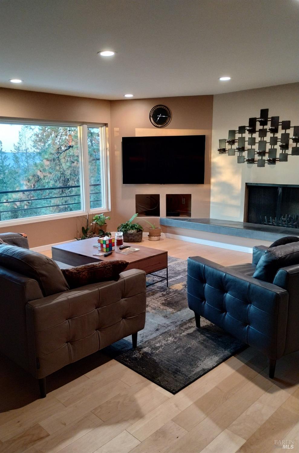 460 Bella Vista Drive Angwin, CA 94508 - Photo 14 of 73 a living room with furniture a flat screen tv and a large window