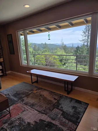 a kitchen with stainless steel appliances a sink a refrigerator a microwave a sink and cabinets