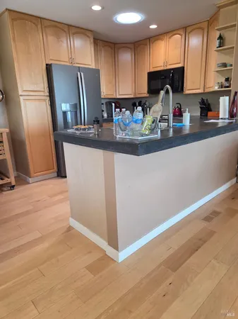 a room with a bed and a large window