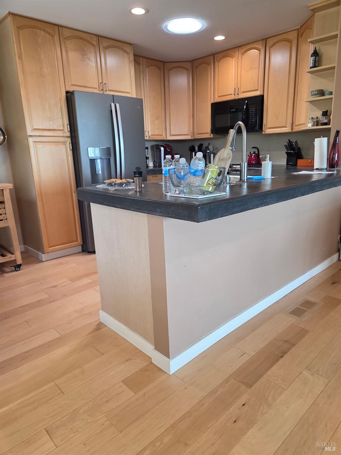 460 Bella Vista Drive Angwin, CA 94508 - Photo 22 of 73 a kitchen with stainless steel appliances granite countertop a refrigerator a stove a sink and a hard wood floors
