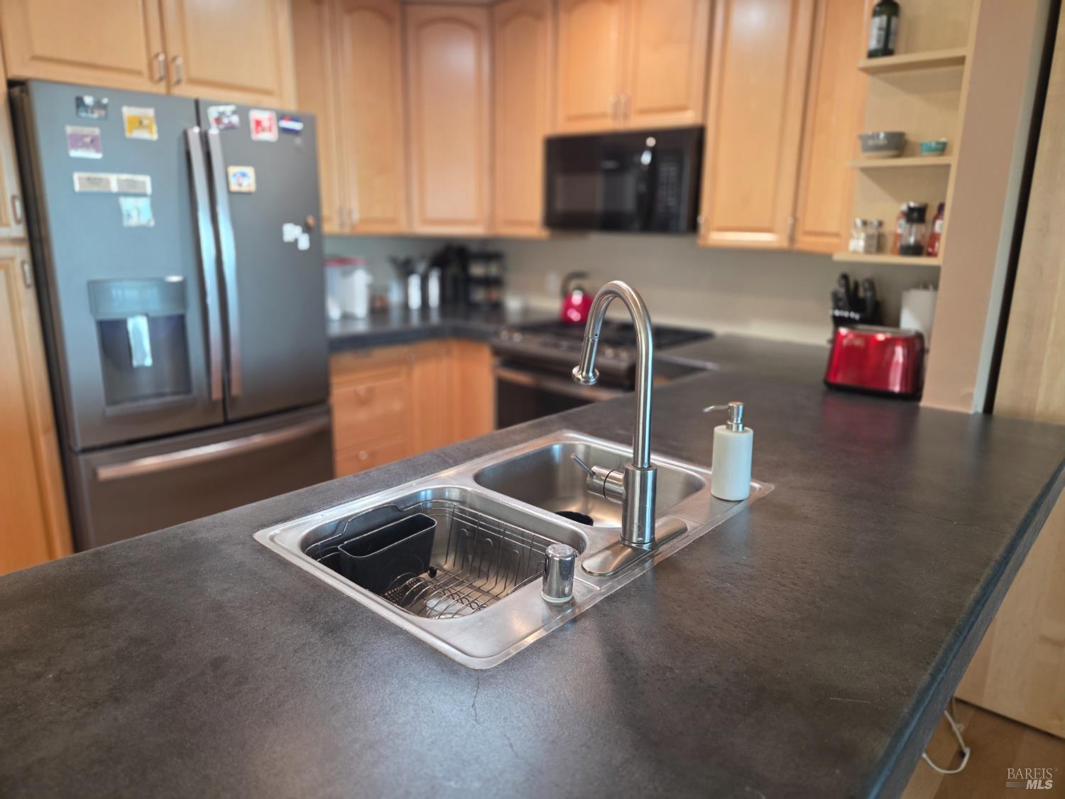 460 Bella Vista Drive Angwin, CA 94508 - Photo 27 of 73 a kitchen with stainless steel appliances a sink a refrigerator a microwave a sink and cabinets
