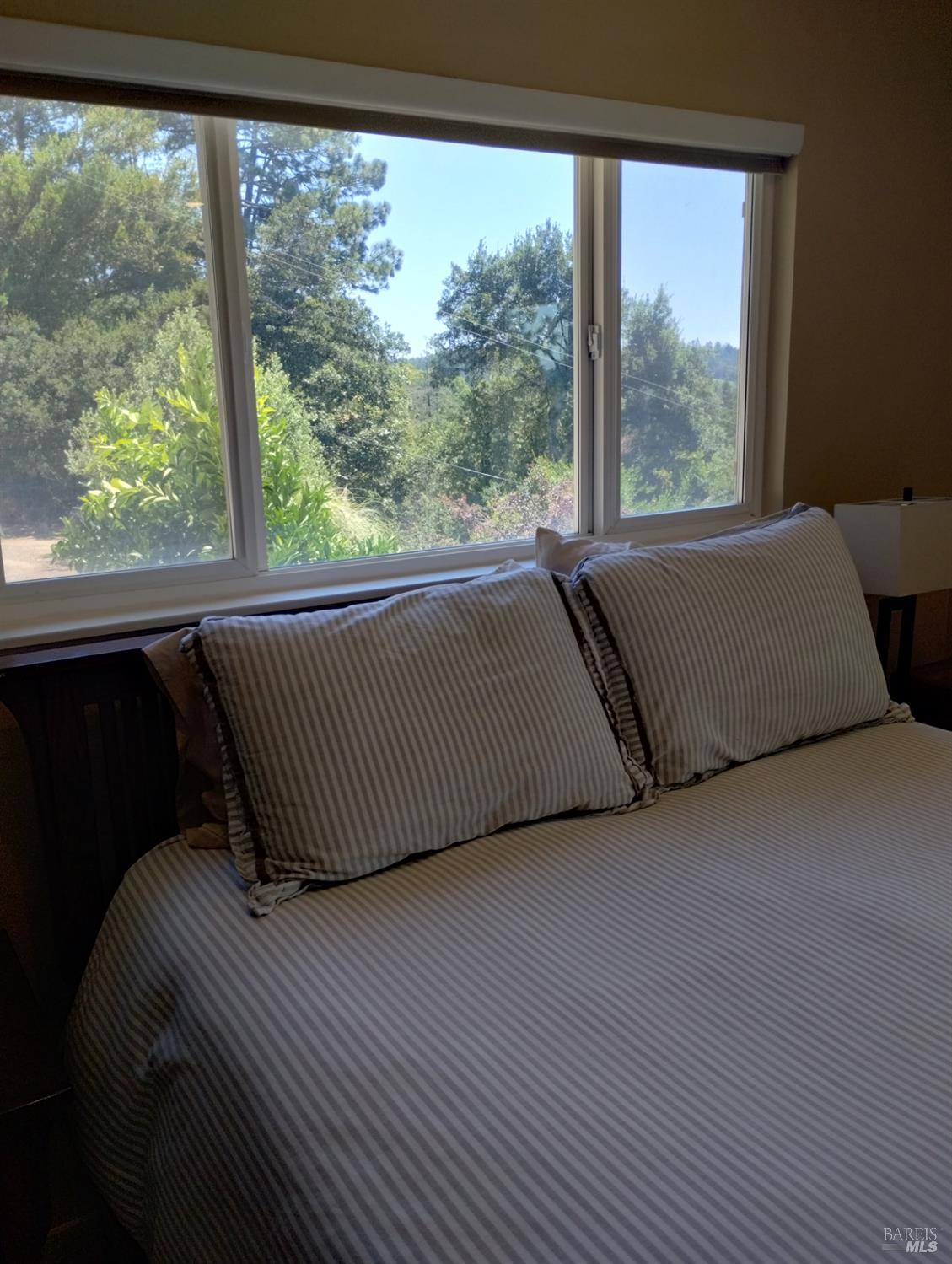 460 Bella Vista Drive Angwin, CA 94508 - Photo 35 of 73 a room with a bed and a large window