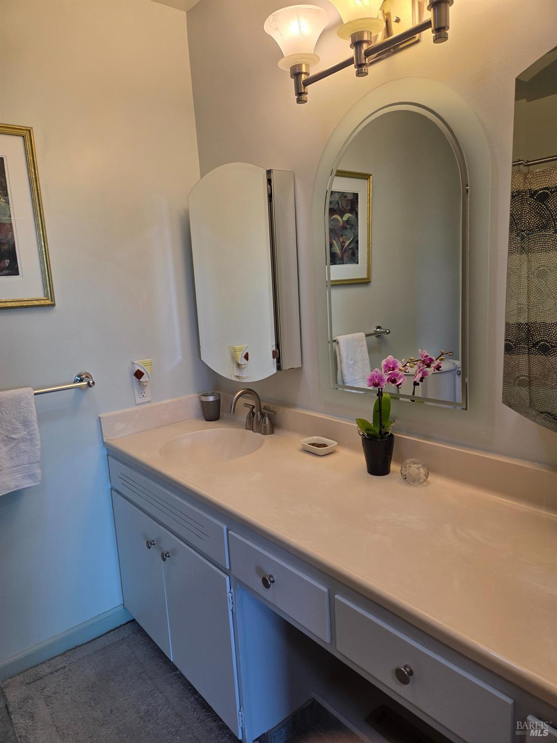 460 Bella Vista Drive Angwin, CA 94508 - Photo 45 of 73 a bathroom with a granite countertop sink a large mirror and vanity