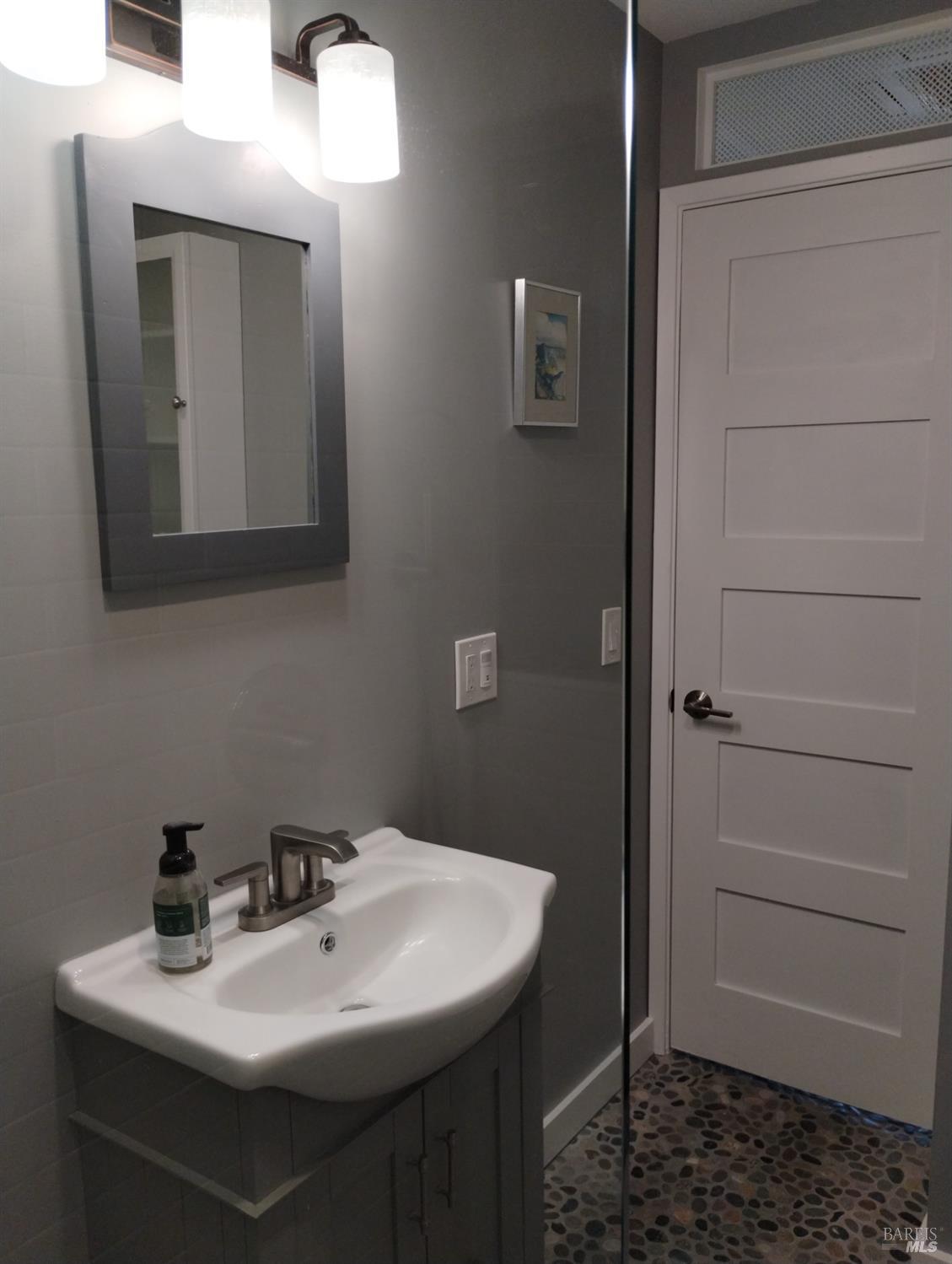 460 Bella Vista Drive Angwin, CA 94508 - Photo 66 of 73 a bathroom with a sink a toilet and mirror