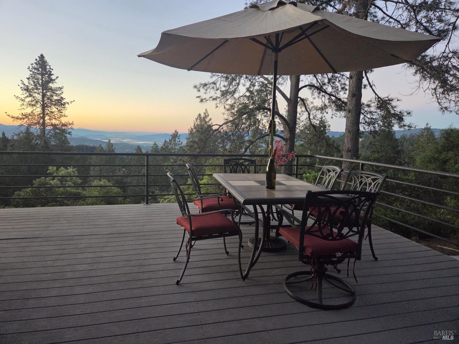 460 Bella Vista Drive Angwin, CA 94508 - Photo 68 of 73 a view of a roof deck with table and chairs under an umbrella