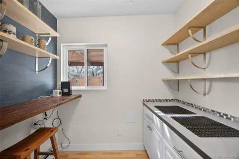 a kitchen that has a stove and a table