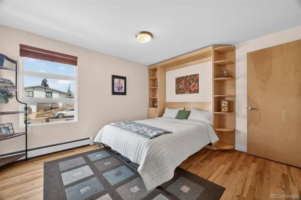 a bedroom with bed and a window