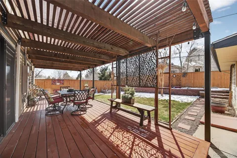 a view of a backyard with sitting area