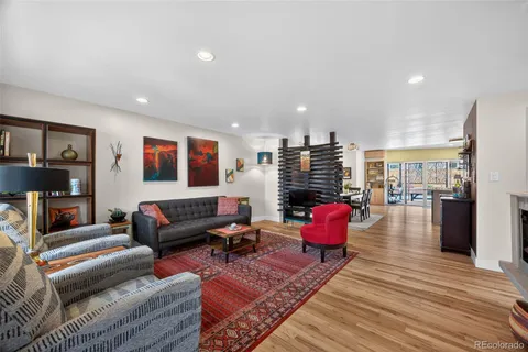 a living room with furniture or couch and a wooden floor
