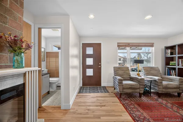 a living room with furniture a window and a fireplace