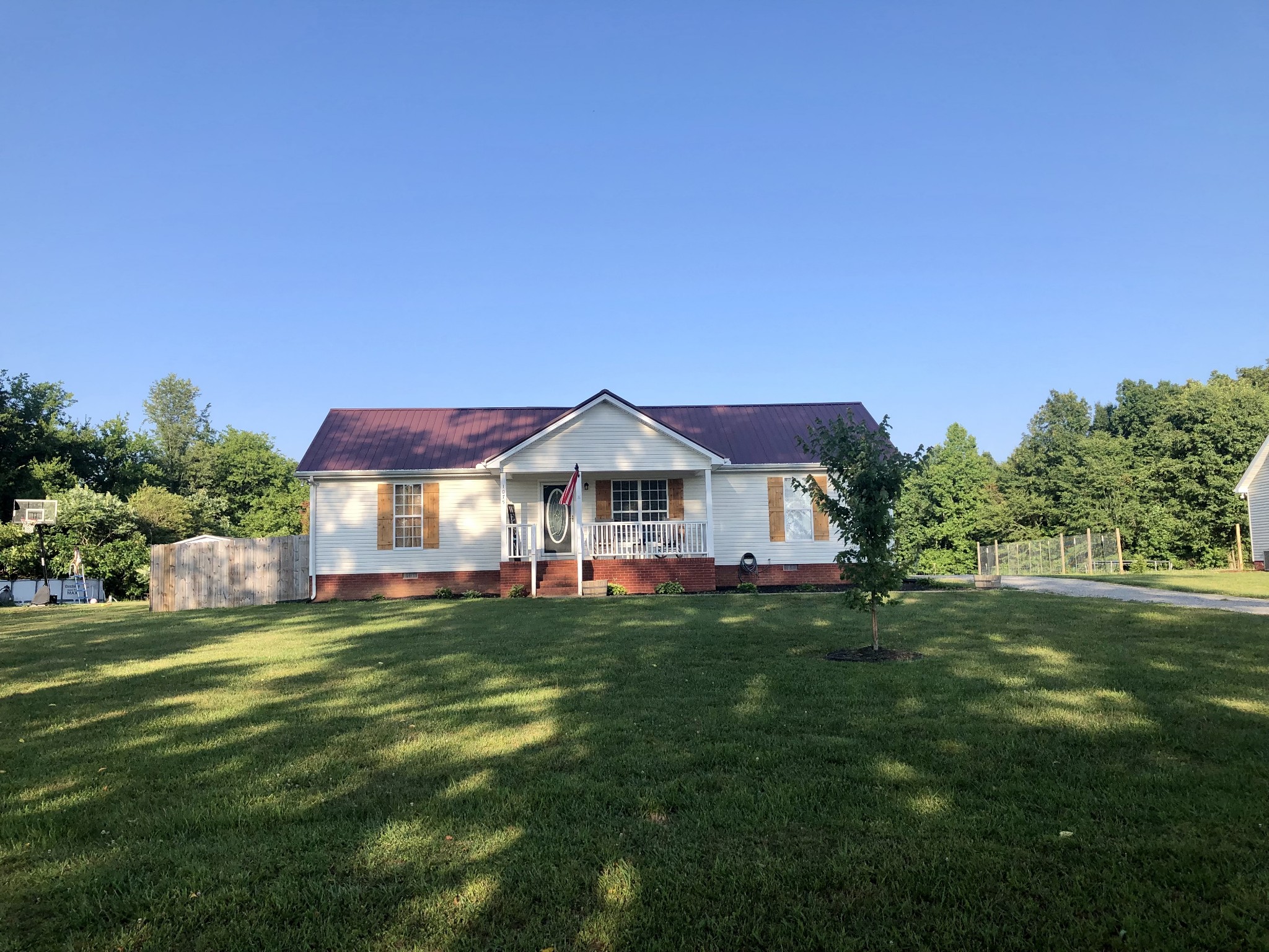 1075 Oak Grove Road Goodspring, TN 38460 - Photo 12 of 38 a front view of a house with a garden