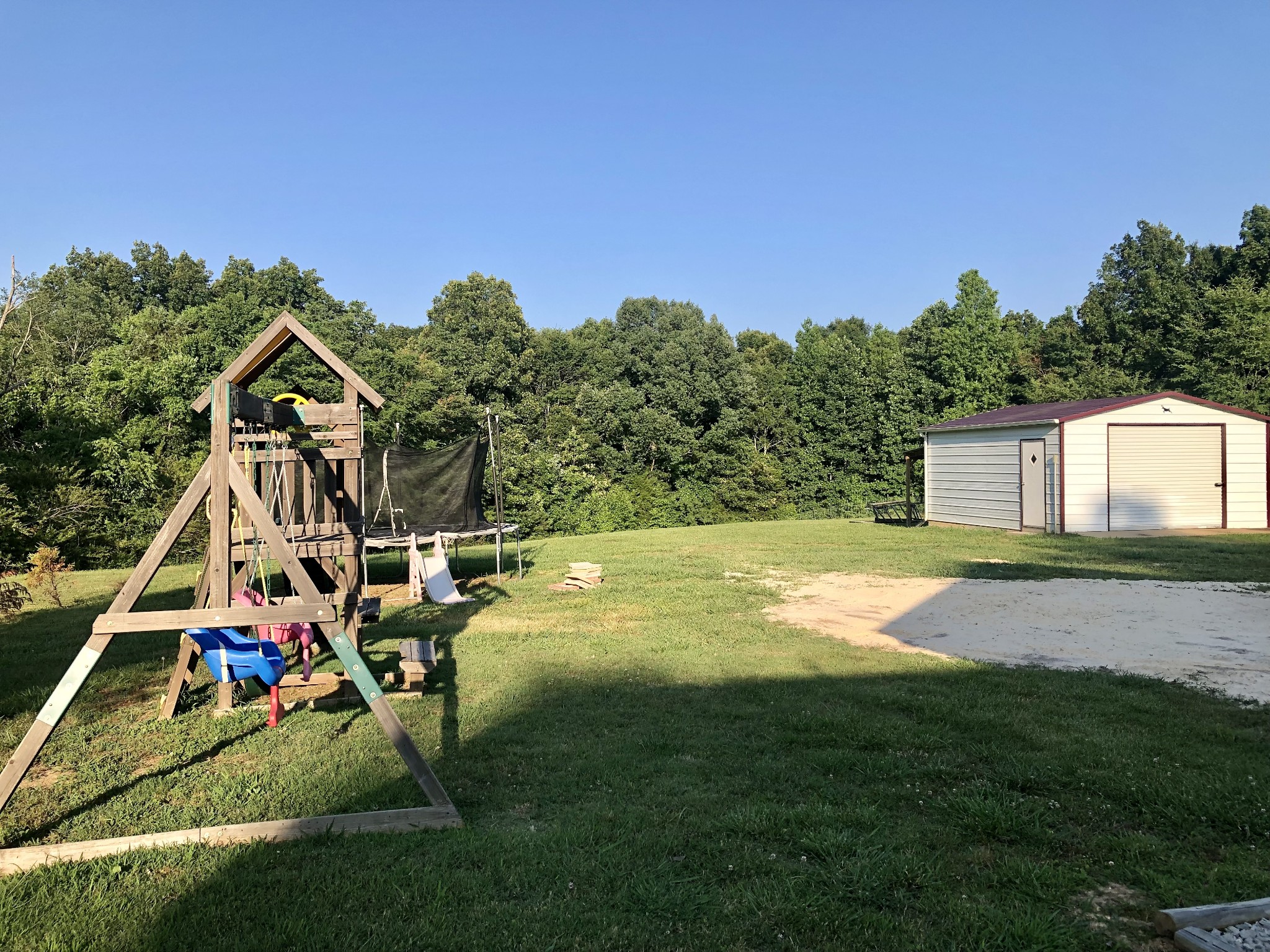 1075 Oak Grove Road Goodspring, TN 38460 - Photo 20 of 38 a view of a backyard with a table and chairs