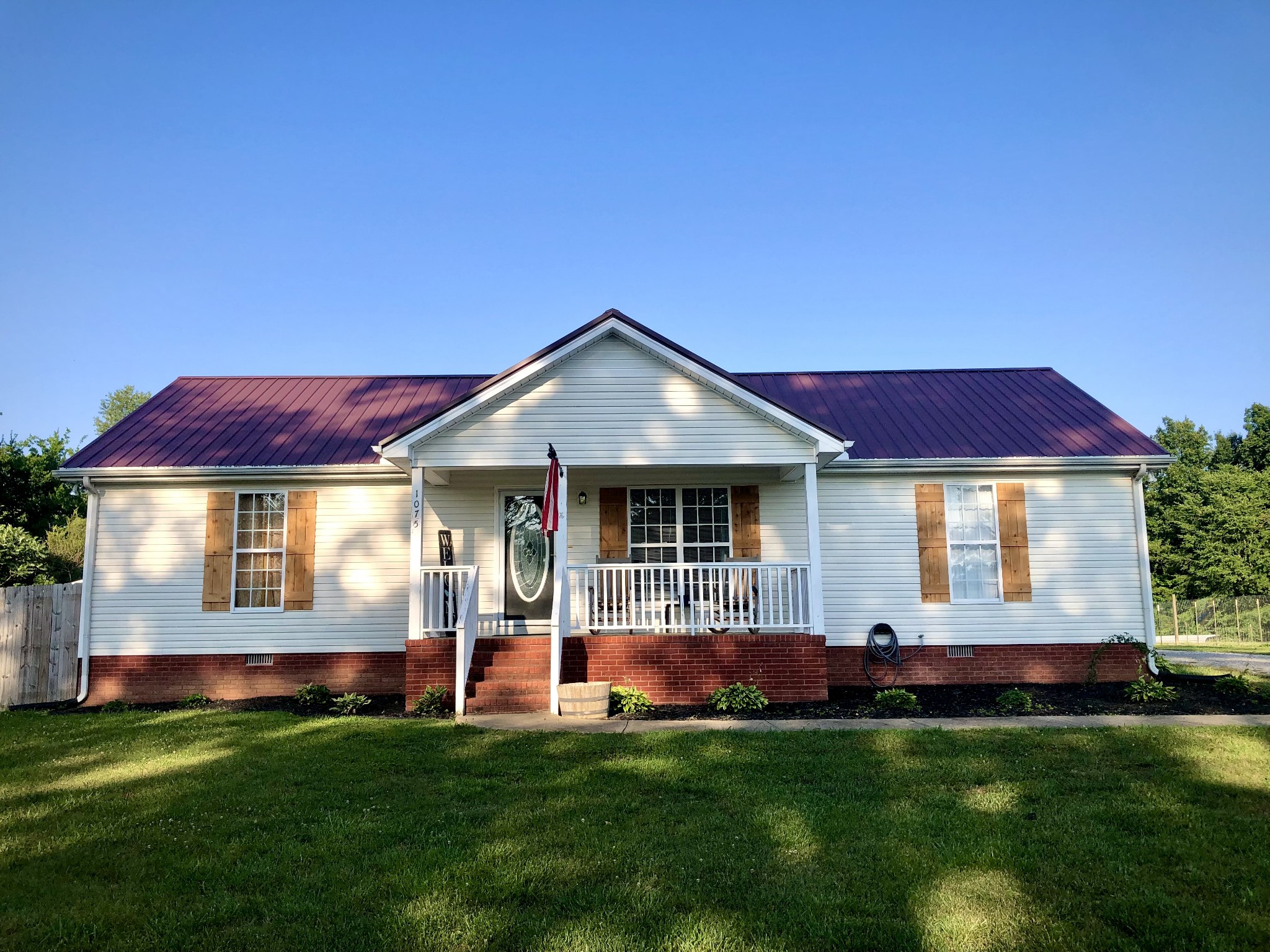 1075 Oak Grove Road Goodspring, TN 38460 - Photo 2 of 38 a front view of a house with a garden
