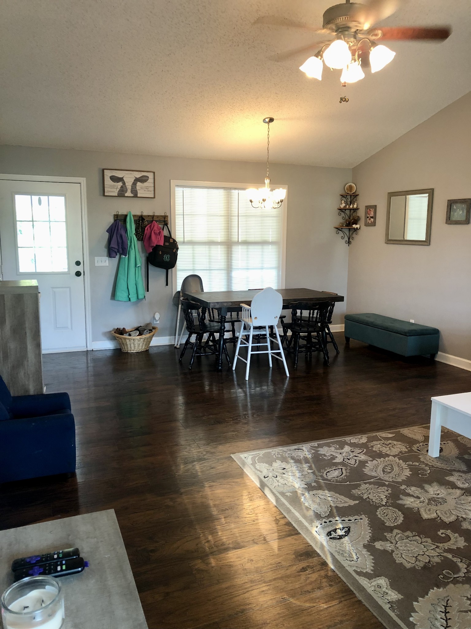 1075 Oak Grove Road Goodspring, TN 38460 - Photo 24 of 38 a dining room with wooden floor a chandelier a glass table and chairs