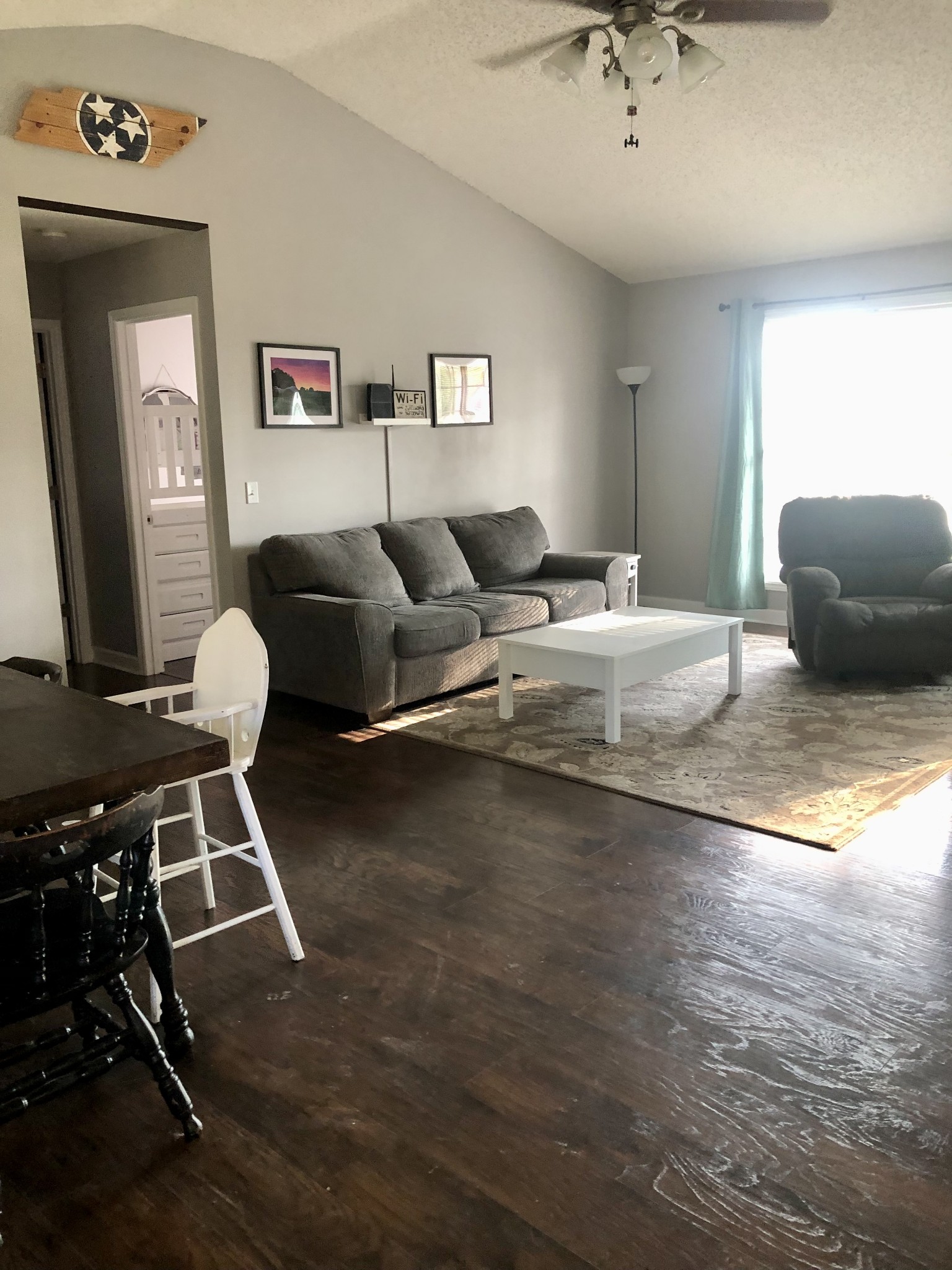 1075 Oak Grove Road Goodspring, TN 38460 - Photo 25 of 38 a living room with furniture and a chandelier