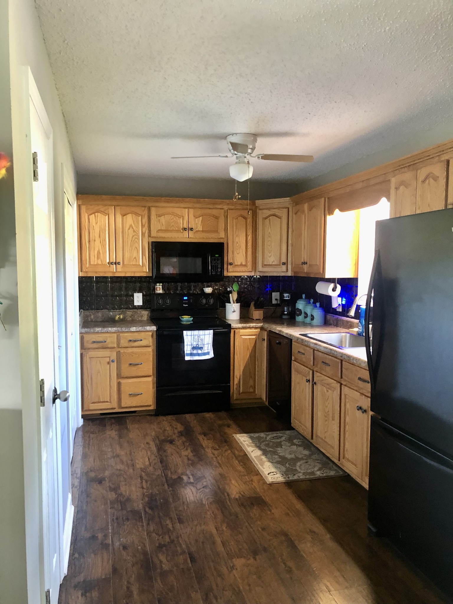 1075 Oak Grove Road Goodspring, TN 38460 - Photo 29 of 38 a kitchen with stainless steel appliances a refrigerator sink and microwave