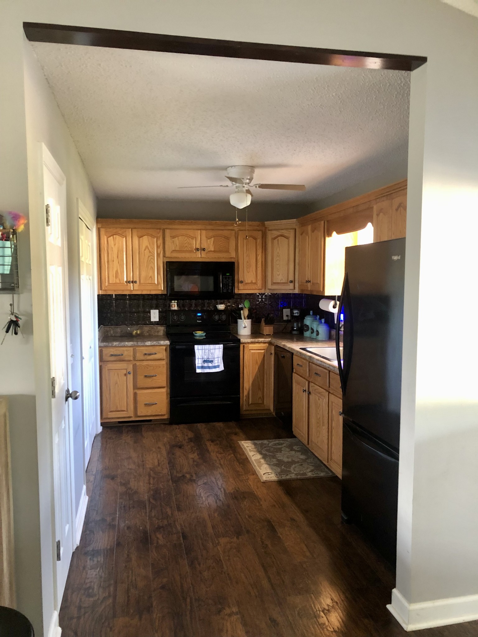 1075 Oak Grove Road Goodspring, TN 38460 - Photo 30 of 38 a kitchen with stainless steel appliances granite countertop a refrigerator a sink dishwasher and a stove with wooden floor
