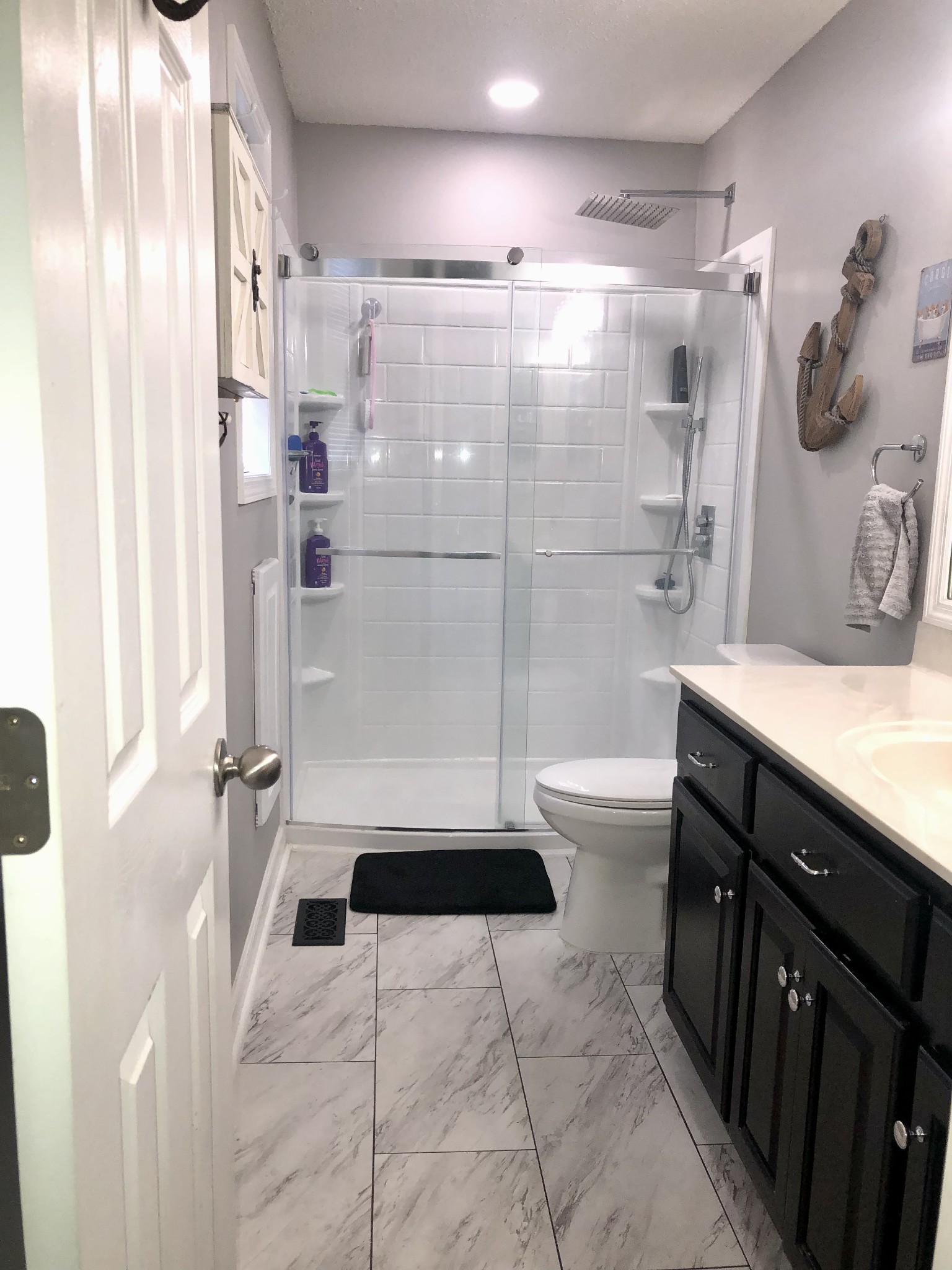 1075 Oak Grove Road Goodspring, TN 38460 - Photo 32 of 38 a bathroom with a sink toilet and shower