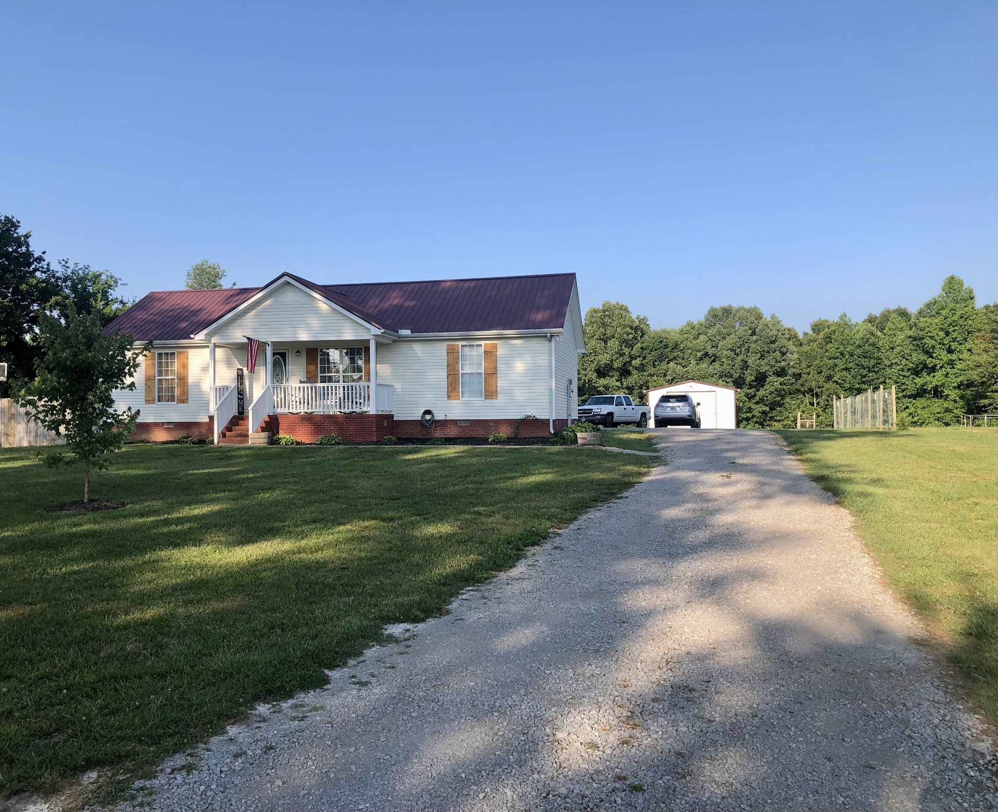 1075 Oak Grove Road Goodspring, TN 38460 - Photo 4 of 38 a front view of a house with a yard