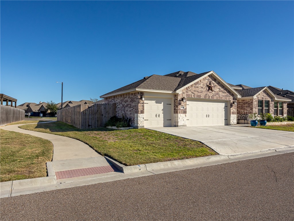 7938 Rancho Vista Boulevard East Corpus Christi, TX 78414 - Photo 2 of 37 Front of Property with extra space for walking pa
