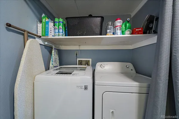 a view of storage and utility room with washer and dryer