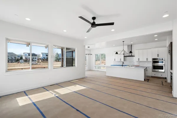 a spacious bathroom with a shower sink and mirror