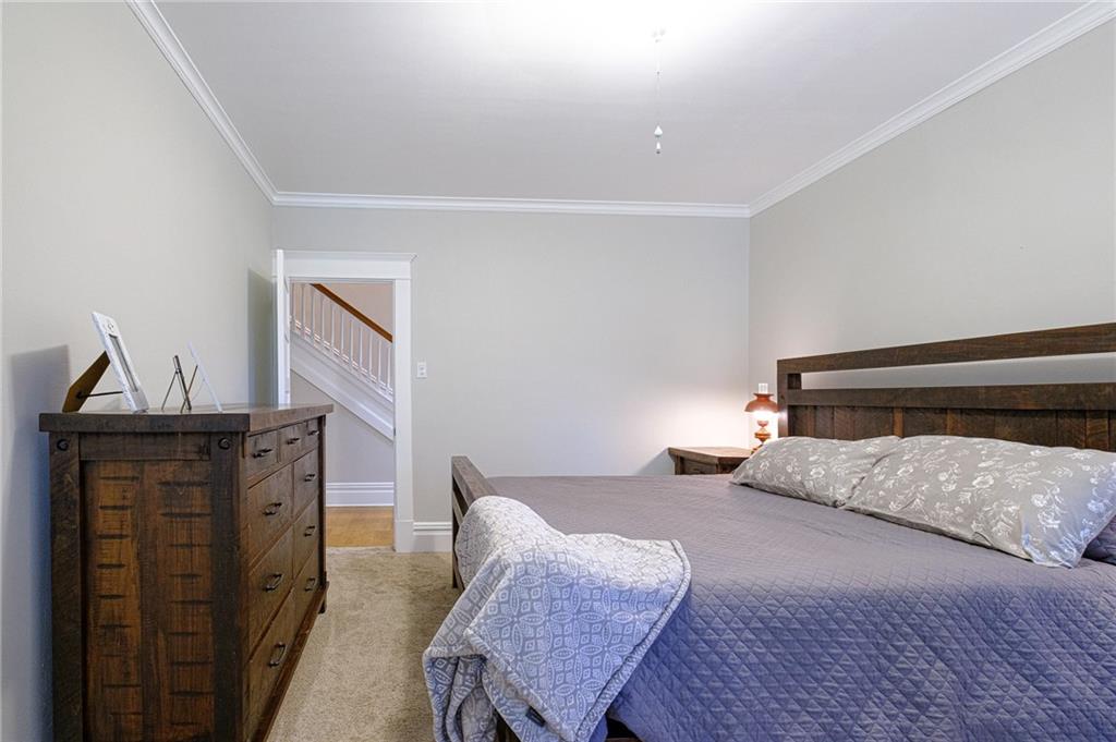 437 Three Degree Road Butler, PA 16002 - Photo 12 of 25 a bedroom with a bed and wooden floor