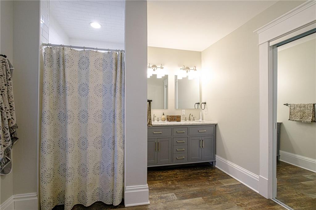 437 Three Degree Road Butler, PA 16002 - Photo 13 of 25 a bathroom with a double vanity sink mirror and shower