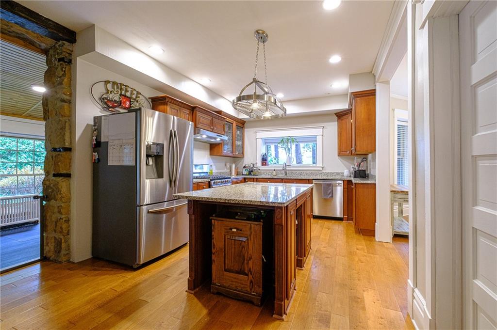 437 Three Degree Road Butler, PA 16002 - Photo 5 of 25 a kitchen with stainless steel appliances granite countertop a refrigerator a sink dishwasher and a refrigerator with wooden floor