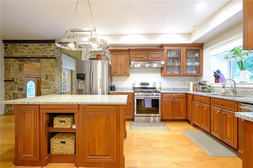 437 Three Degree Road Butler, PA 16002 - Photo 6 of 25 a kitchen with kitchen island a sink counter top space and appliances
