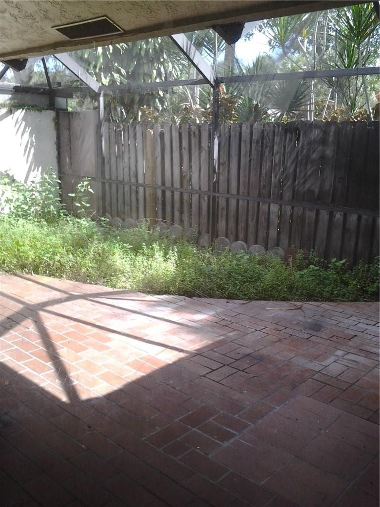23342 Southwest 54th Way, Unit B Boca Raton, FL 33433 - Photo 9 of 14 Large screened & fenced patio-garden